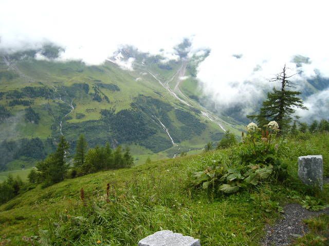 Green valley with low hanging clouds
