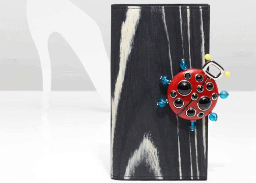 Belle Vivier wood clutch with ladybird clasp